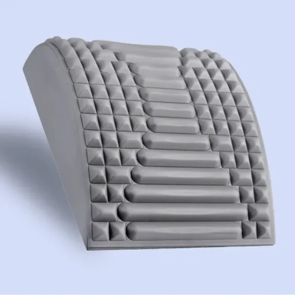 Lower back pain relief stretcher in gray.