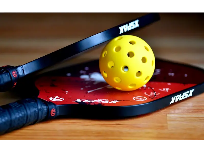 A pickleball image to check do indoor pickleball balls have smaller holes.